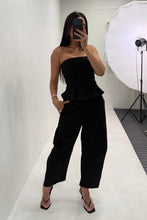 Load image into Gallery viewer, Pleated Strapless Peplum Barrel Jumpsuit- Black
